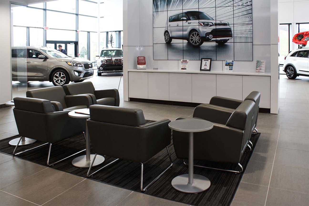 Freedom KIA Dealership-Lounge chairs and side tables- designed by Omega Commercial Interiors